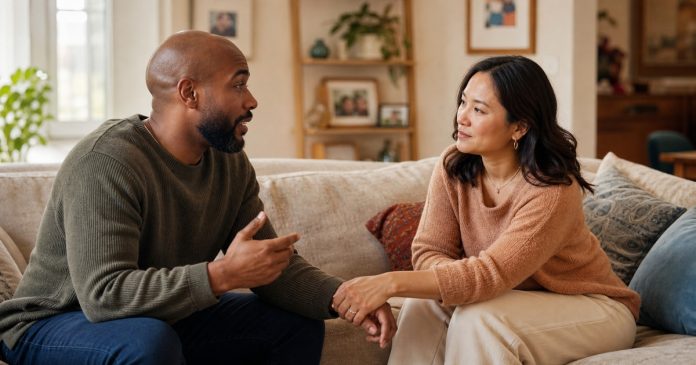 Interracial couple having a warm, attentive conversation together at home